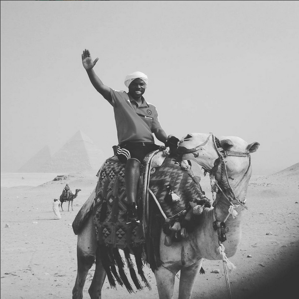 collins-mbesuma-rides-a-camel-in-egypt